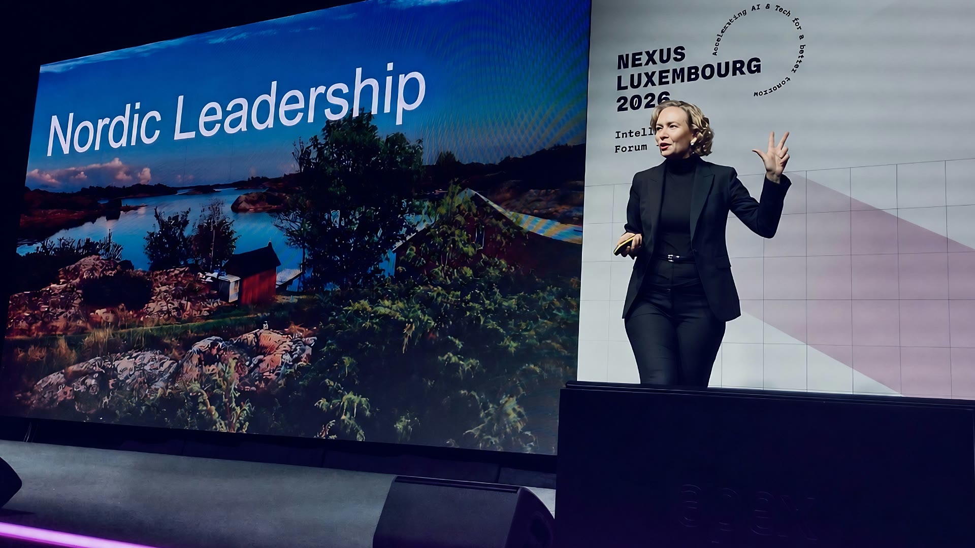 Tarja Stephens on the Nexus Luxembourg stage with a Nordic Leadership slide behind her