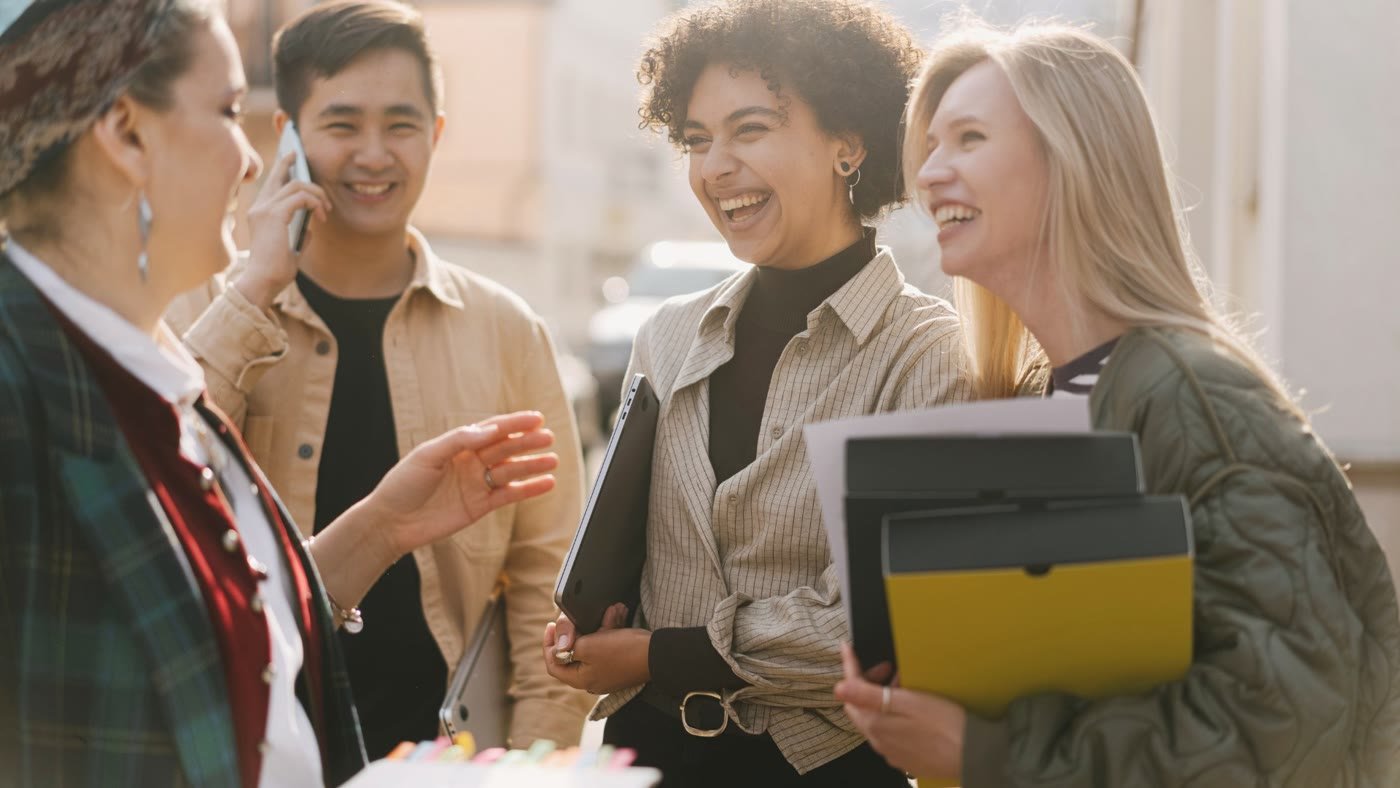 A group of colleagues laughing together