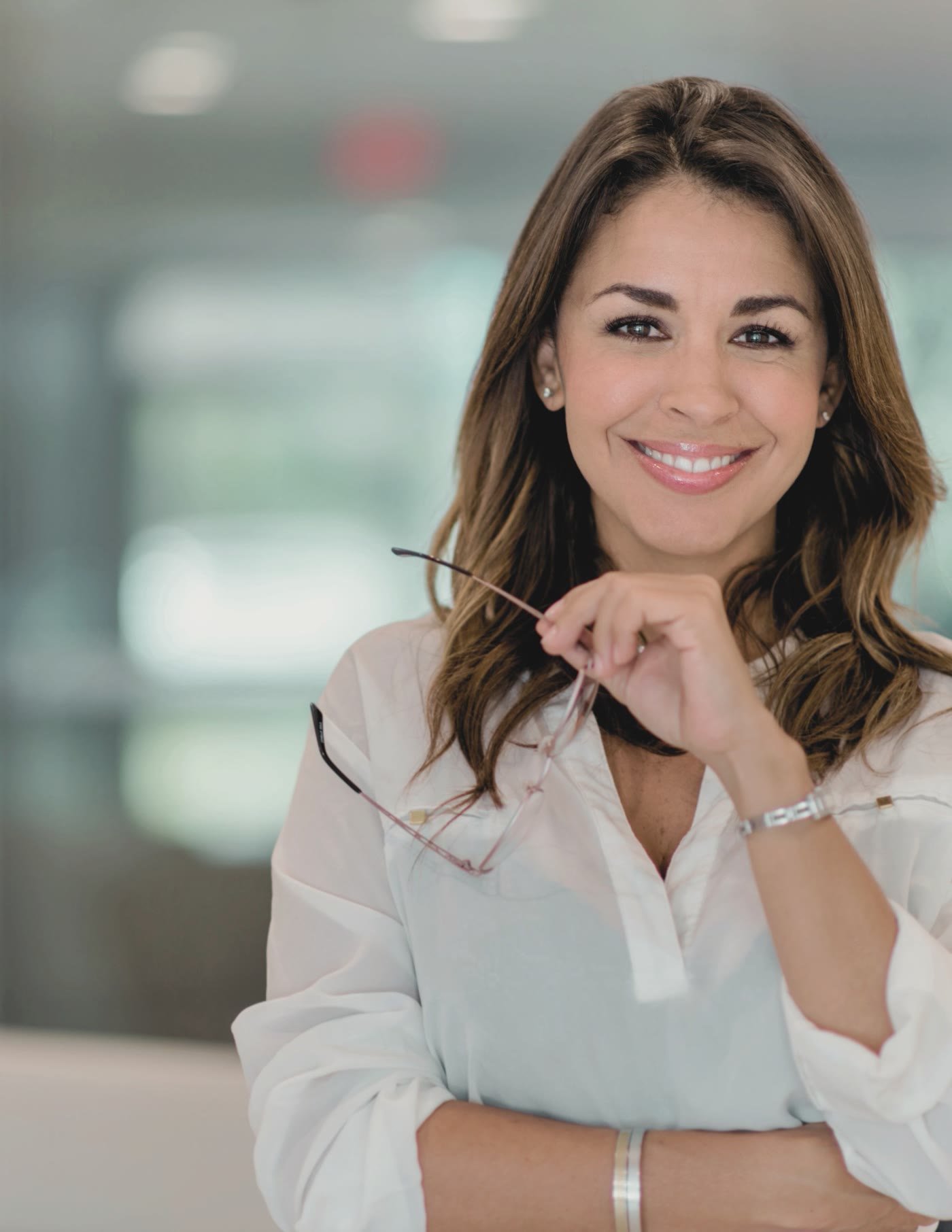An executive in a white shirt, smiling