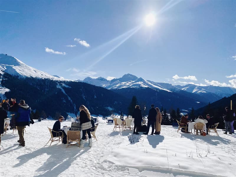 An outdoor gathering in the snow above Davos
